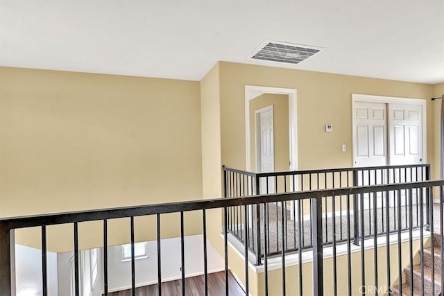 hallway with dark wood-type flooring