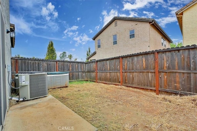 view of yard with central AC