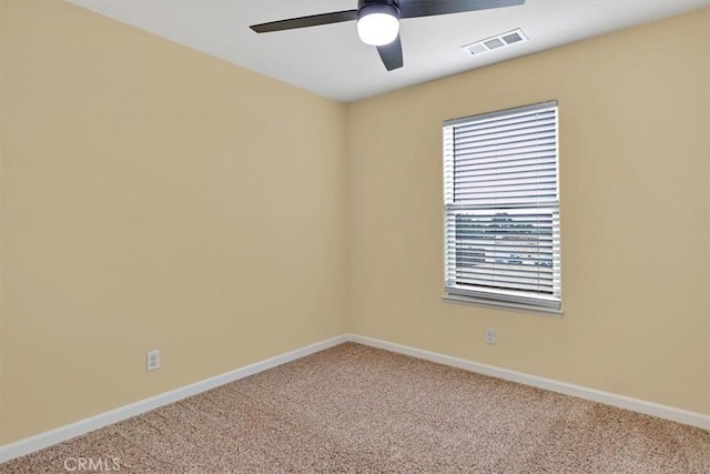 unfurnished room featuring ceiling fan and carpet floors