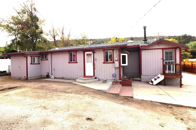 back of house with a patio