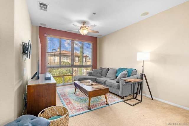 living room with light carpet and ceiling fan