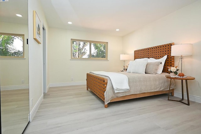 bedroom with light hardwood / wood-style floors