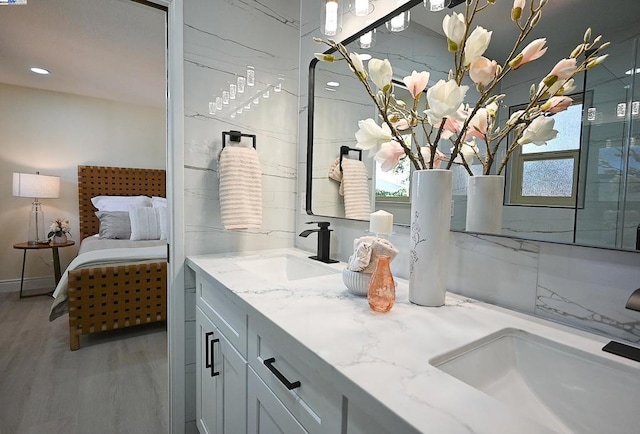 bathroom featuring hardwood / wood-style flooring and vanity