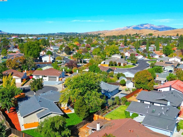 birds eye view of property with a mountain view