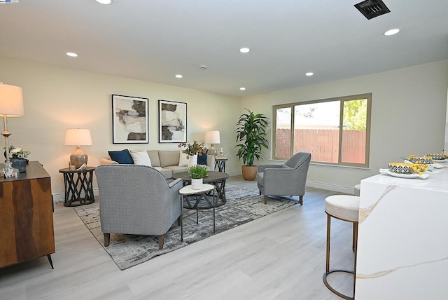 living room with light hardwood / wood-style flooring