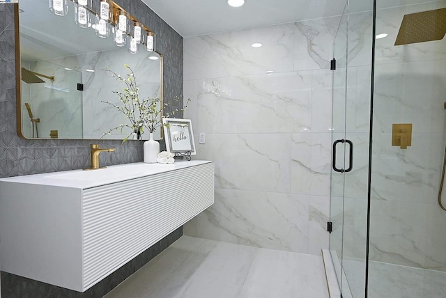 bathroom with an enclosed shower and vanity