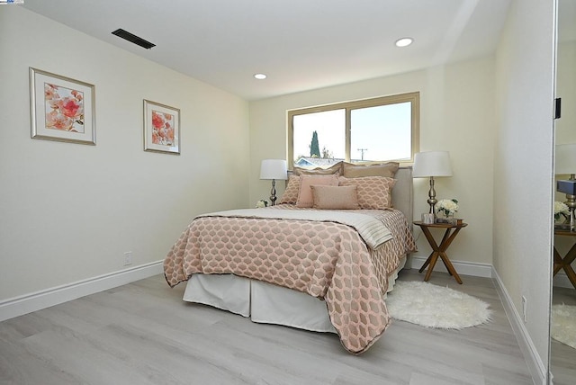 bedroom featuring light hardwood / wood-style floors