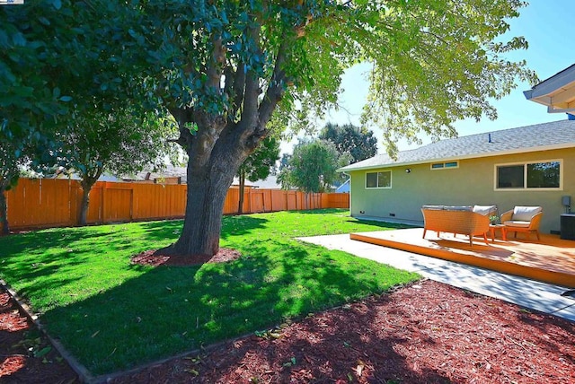 view of yard with outdoor lounge area and a wooden deck