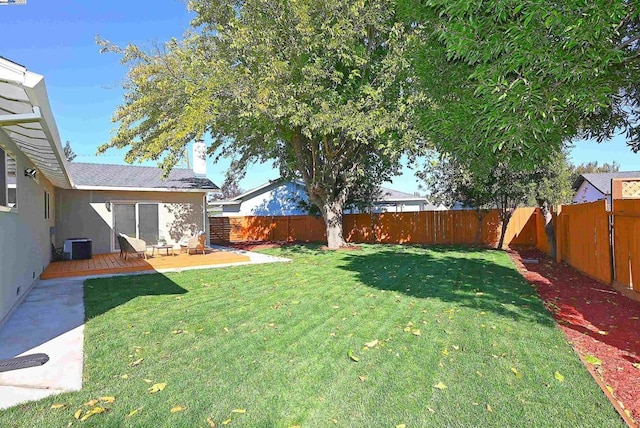 view of yard featuring a patio area and central AC unit