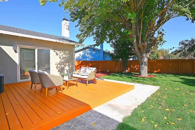 wooden deck featuring a yard and outdoor lounge area