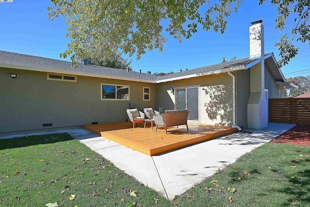 back of house with an outdoor hangout area, a deck, and a lawn