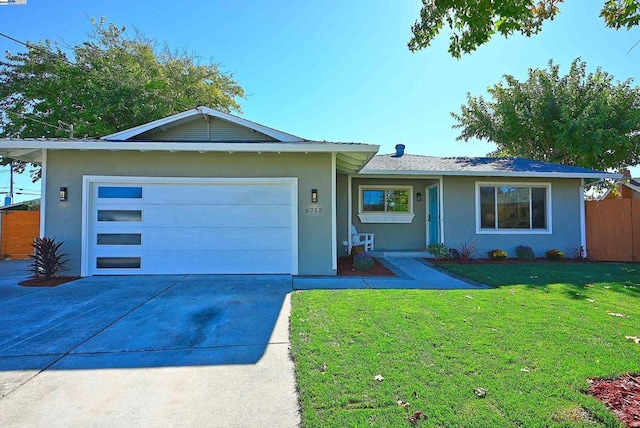 ranch-style house with a front yard and a garage