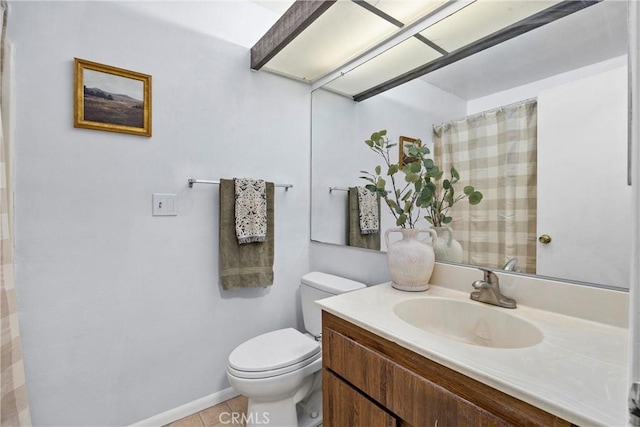 bathroom with toilet, tile patterned flooring, and vanity