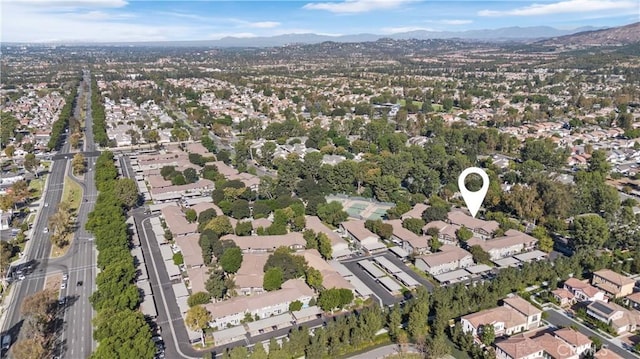 birds eye view of property featuring a mountain view