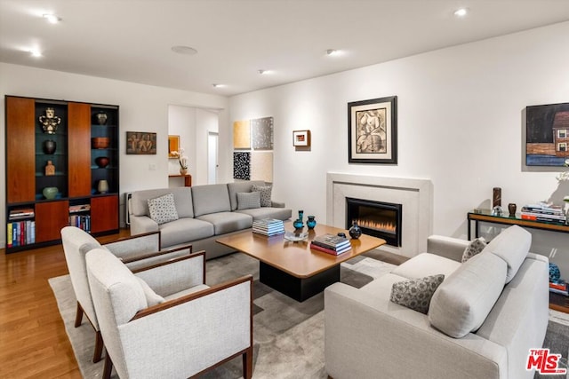 living room with light hardwood / wood-style flooring