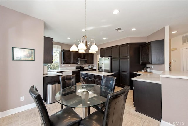 dining room with an inviting chandelier and sink