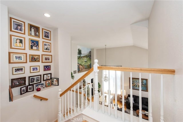 stairs with vaulted ceiling