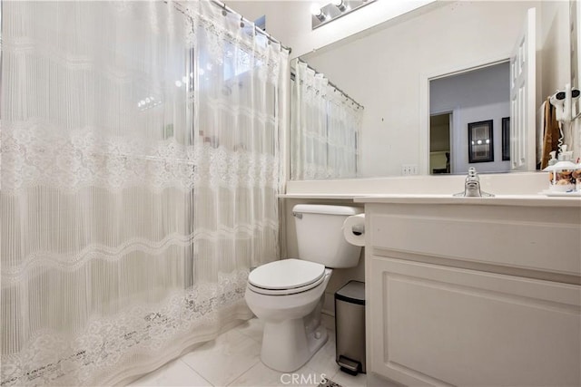 bathroom with a shower with shower curtain, vanity, toilet, and tile patterned flooring