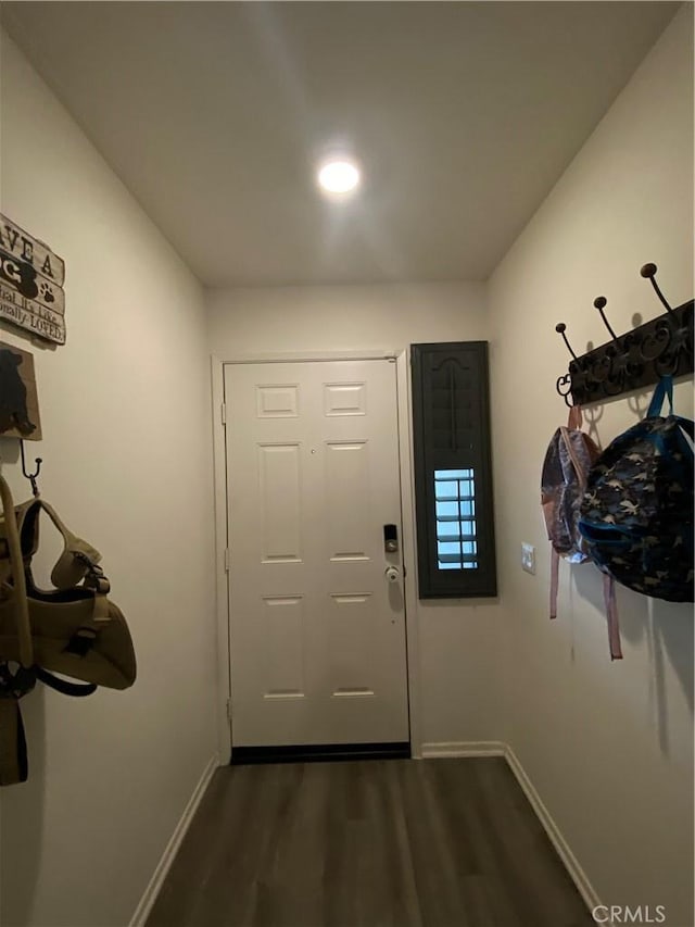 doorway with dark hardwood / wood-style flooring