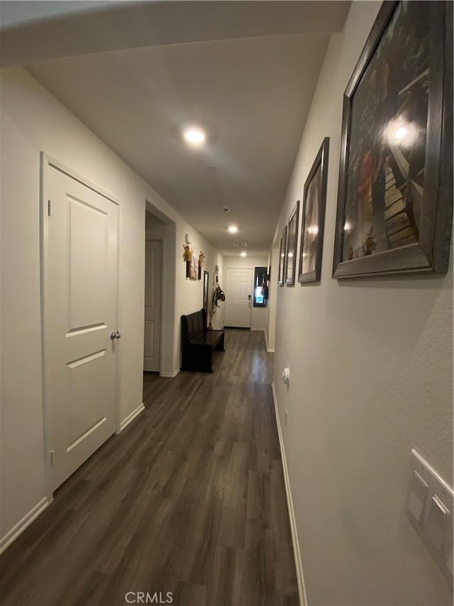 hallway featuring dark hardwood / wood-style flooring