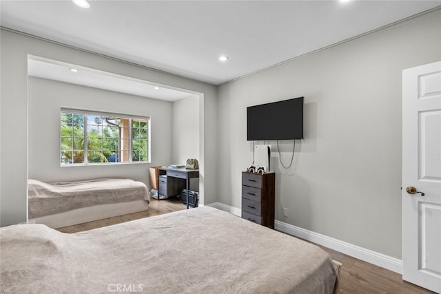 bedroom featuring hardwood / wood-style flooring