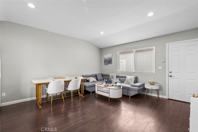 living room with dark hardwood / wood-style floors and vaulted ceiling