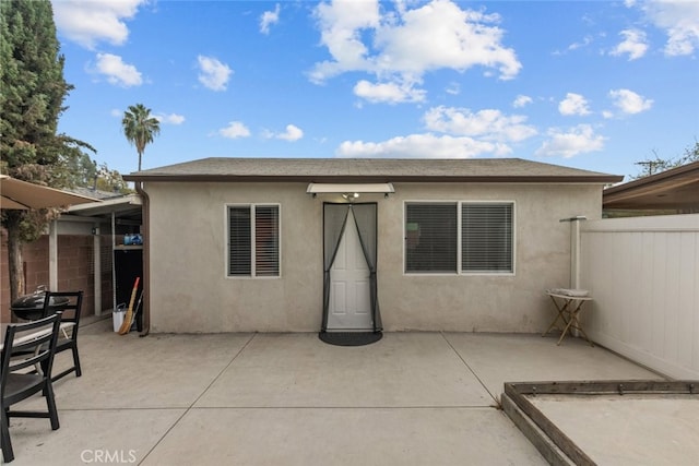 back of property with a patio area