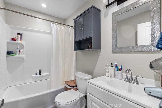 full bathroom with shower / tub combo, vanity, and toilet