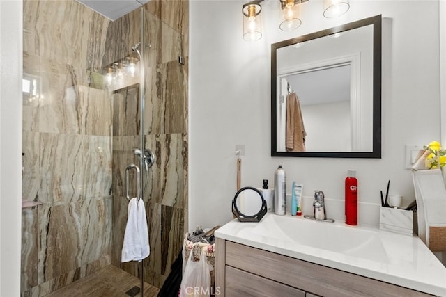 bathroom featuring vanity and a shower with shower door