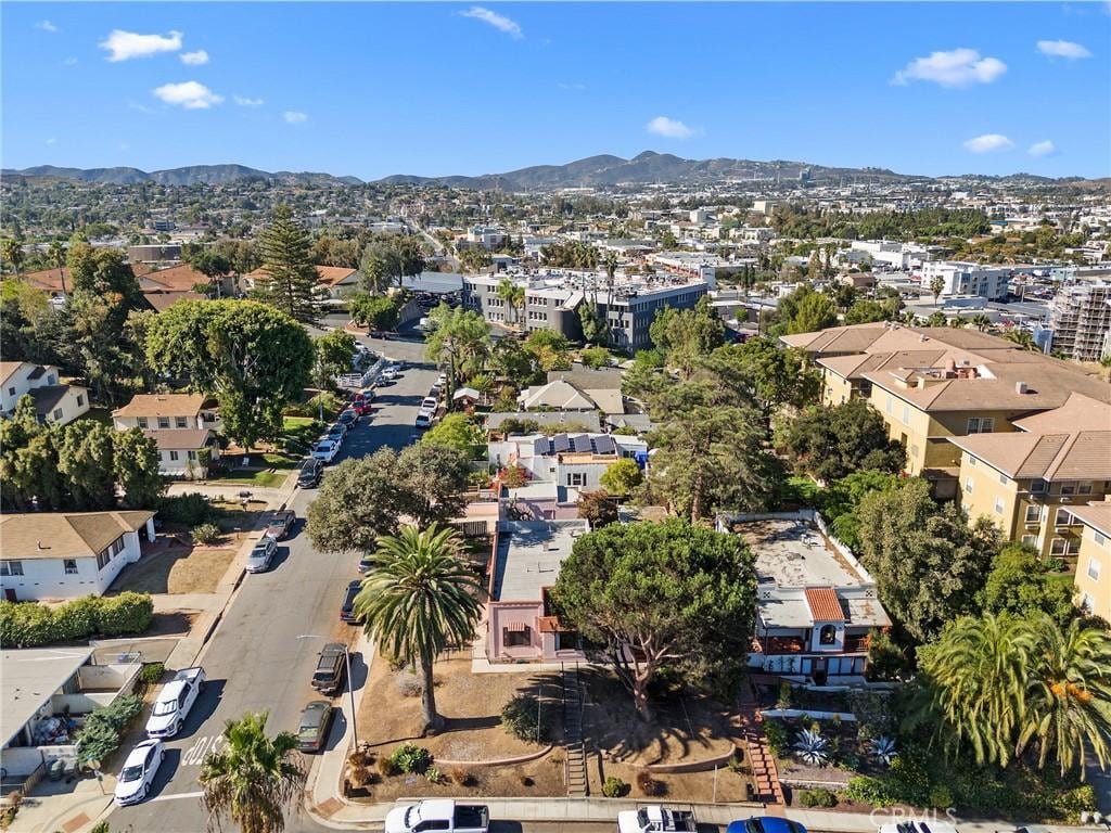 birds eye view of property with a mountain view