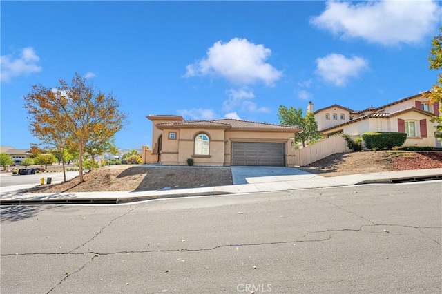 mediterranean / spanish house featuring a garage