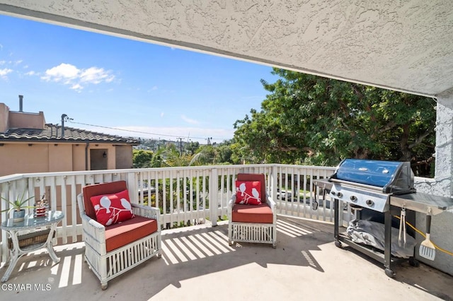 view of patio / terrace with a grill and a balcony