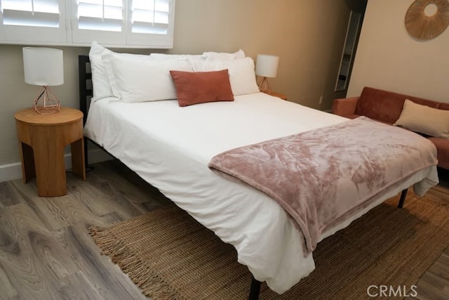 bedroom featuring hardwood / wood-style floors