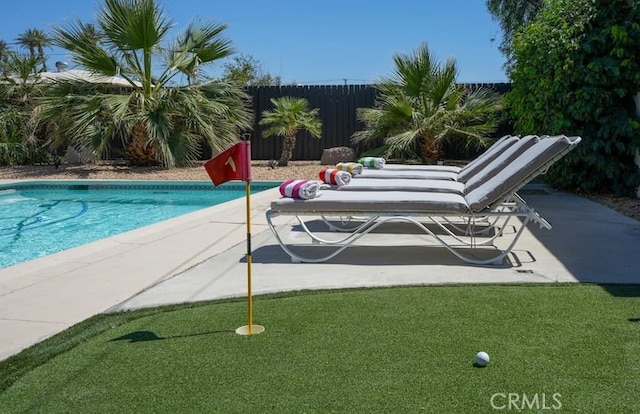 view of swimming pool with a patio area