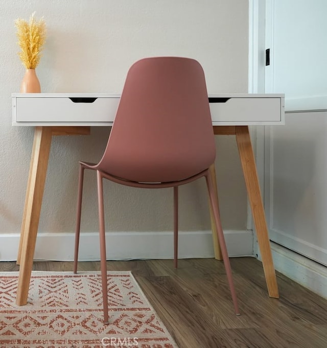 home office with hardwood / wood-style flooring