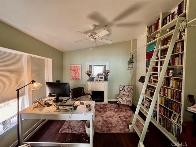 office featuring wood-type flooring, vaulted ceiling, and ceiling fan