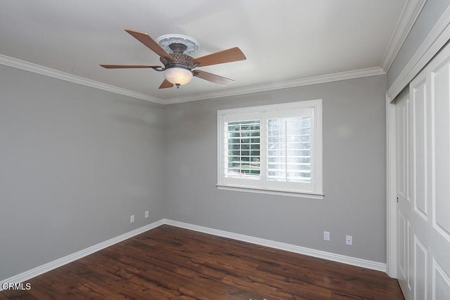 unfurnished room with crown molding, ceiling fan, and dark hardwood / wood-style floors