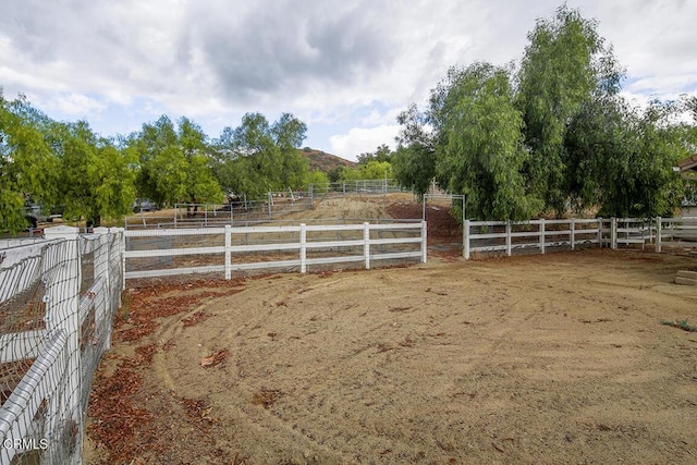 view of yard with a rural view