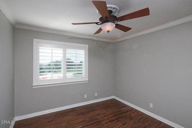 spare room featuring ceiling fan, dark hardwood / wood-style floors, and ornamental molding