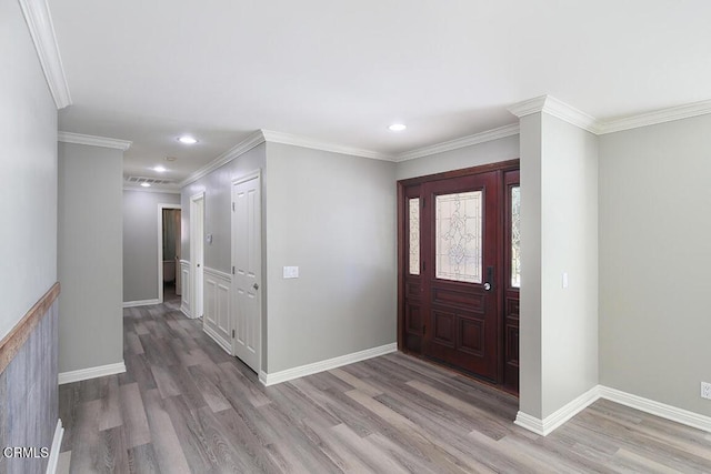 foyer entrance featuring wood-type flooring and ornamental molding