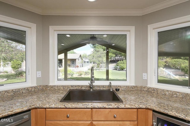 kitchen with crown molding, sink, dishwasher, wine cooler, and lofted ceiling