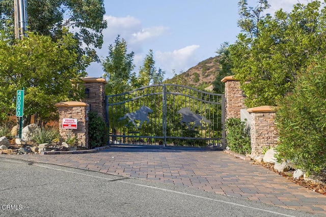 view of gate featuring a mountain view