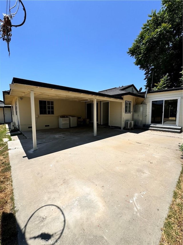 back of property with cooling unit