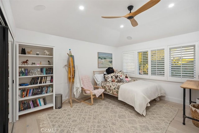 bedroom featuring baseboards, ceiling fan, wood finished floors, vaulted ceiling, and recessed lighting