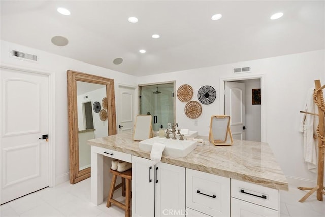 full bathroom featuring vanity, visible vents, a shower, and recessed lighting