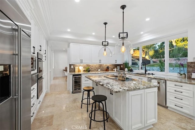 kitchen featuring white cabinetry, a kitchen island, a sink, built in appliances, and beverage cooler