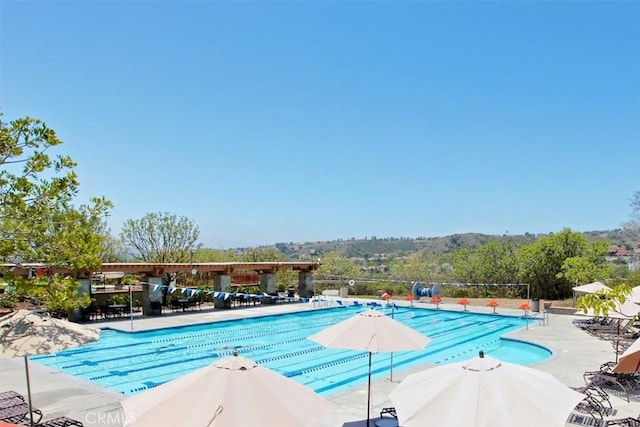 community pool with a patio area