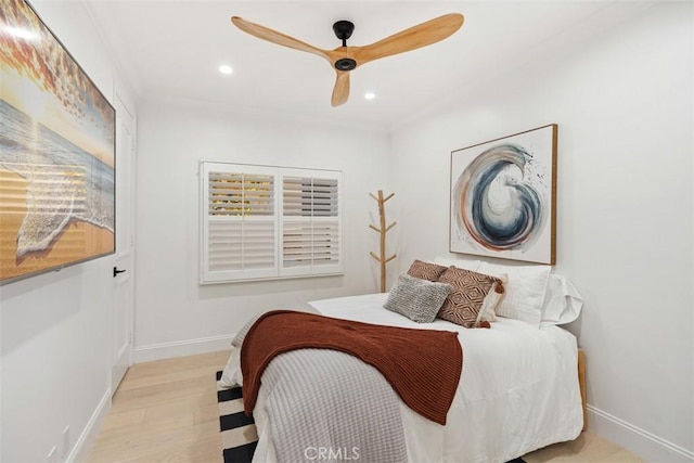 bedroom featuring ceiling fan, baseboards, wood finished floors, and recessed lighting