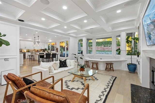 living room featuring beam ceiling, a decorative wall, coffered ceiling, and a high end fireplace