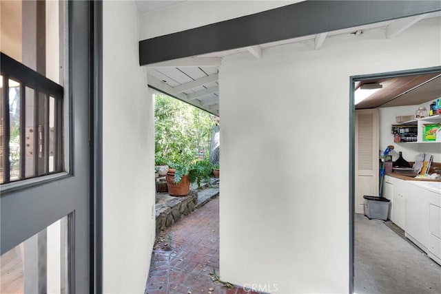 view of patio / terrace with washing machine and dryer